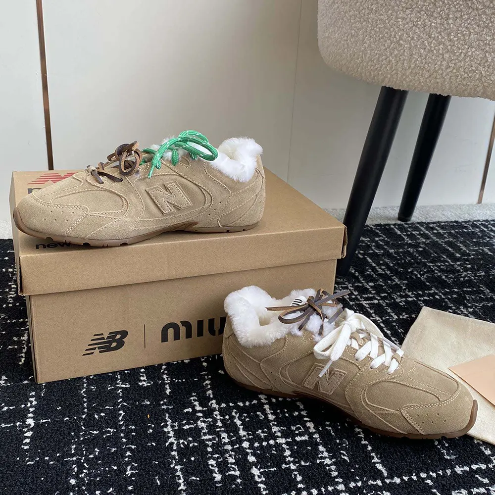 Top angle showing lace-up closure and logo on Miu Miu 530 SL sneakers