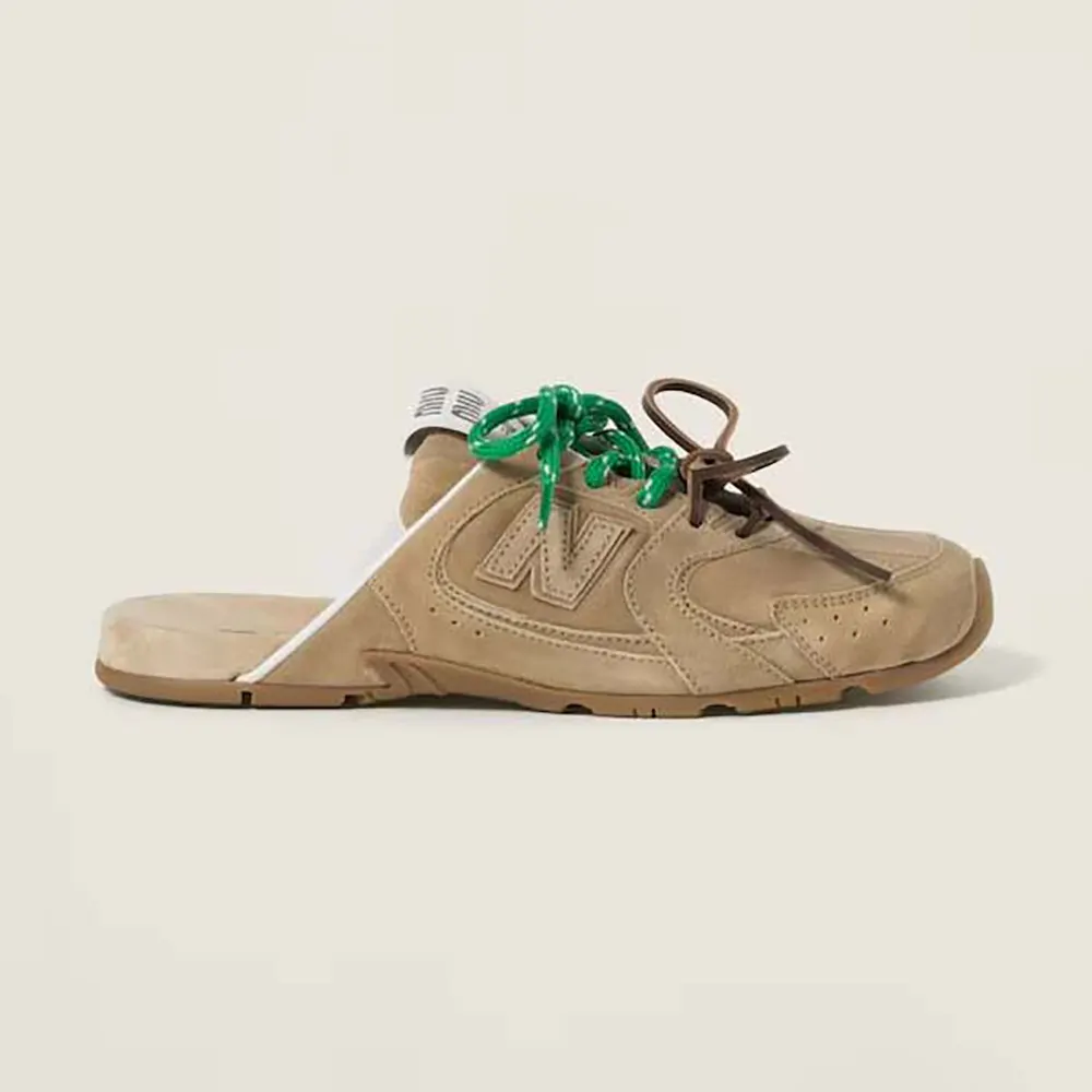 Side view of Miu Miu Women New Balance X Miu Miu 530 SL Faded Suede Mules in brown