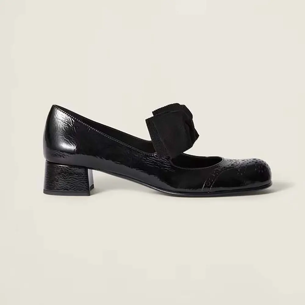 Side profile of Miu Miu Women Patent Leather Pumps with Bow-Black