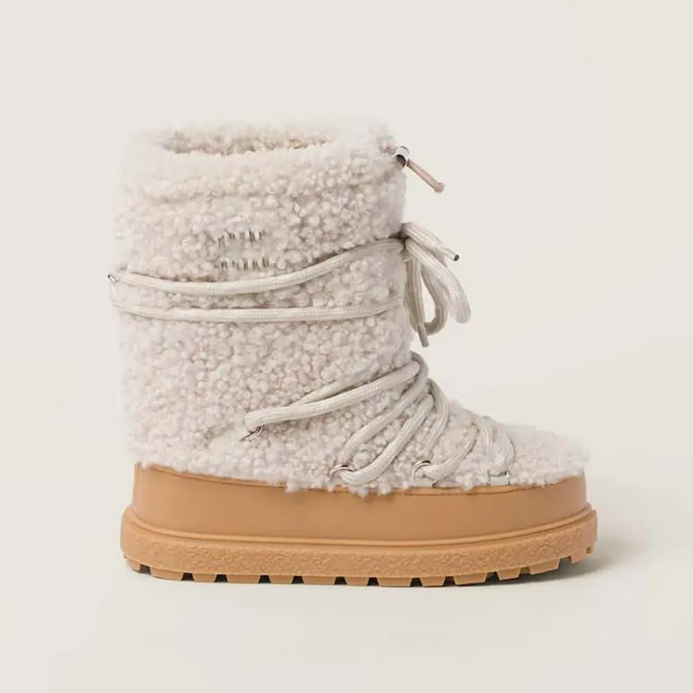 Front angle of Miu Miu Women Shearling Après-ski Boots-White on white background