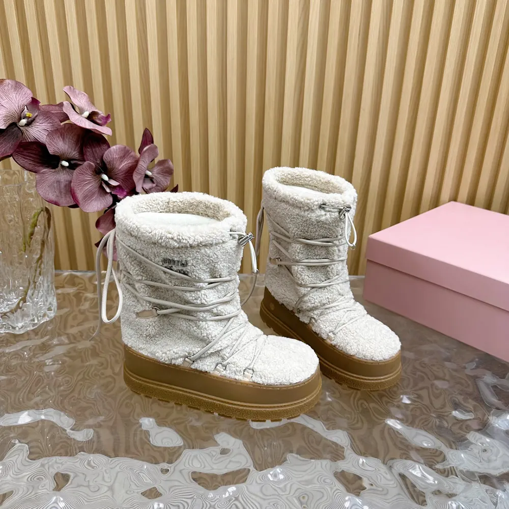 Side view showcasing metal hardware and chunky sole on Miu Miu Women Shearling Après-ski Boots-White