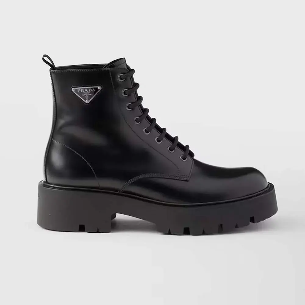 Side profile of Prada Unisex Brushed Leather Combat Boots-Black showing silhouette