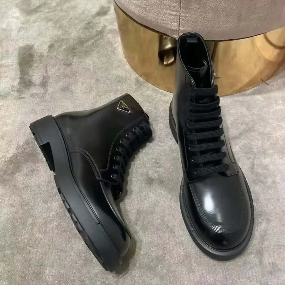Top-down view of lacing detail on Prada Unisex Brushed Leather Combat Boots-Black
