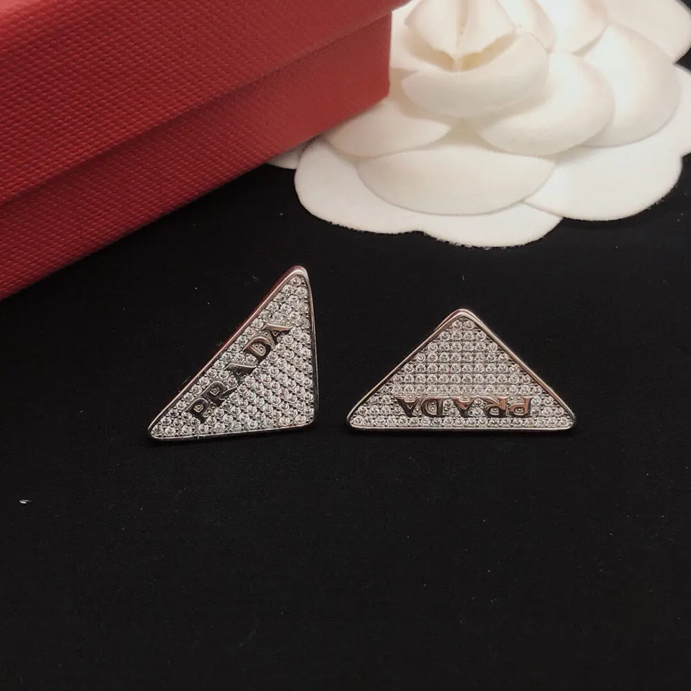 Side angle showing push-back closure of Prada Women Crystal Logo Jewels Earring
