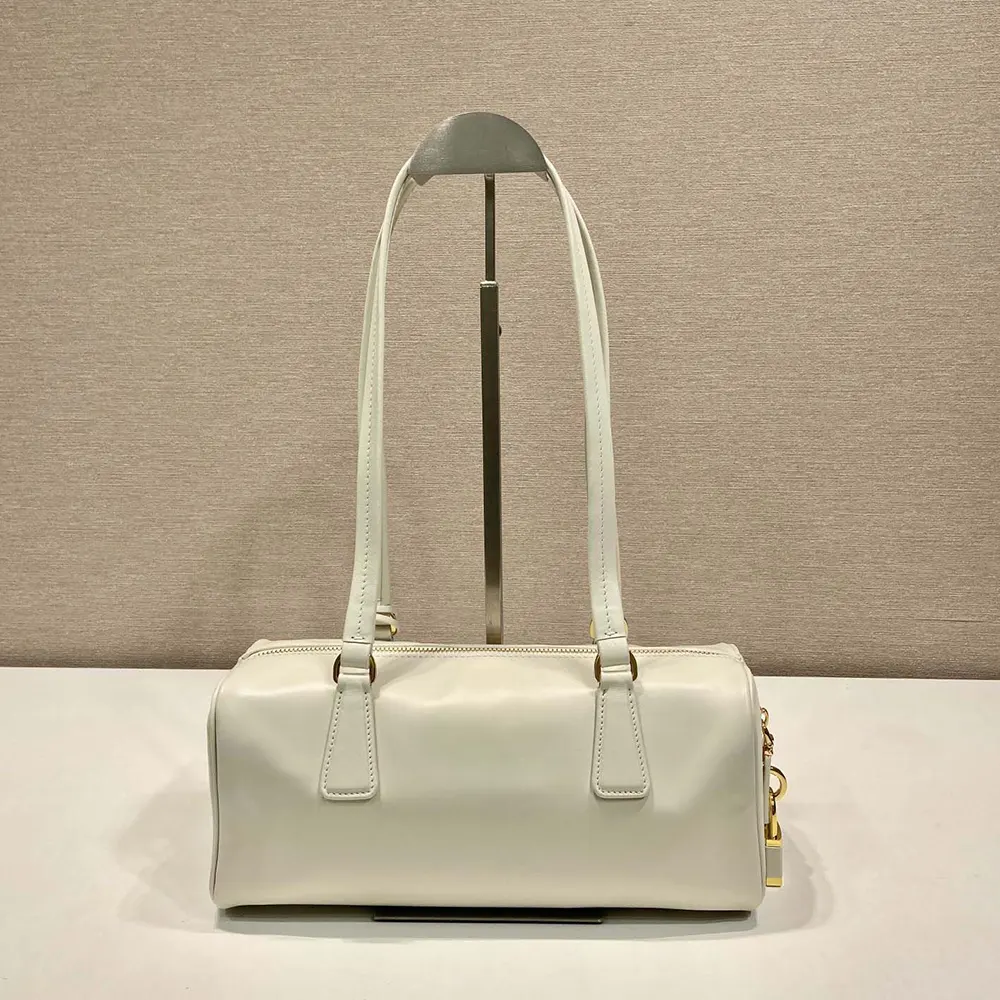 Side angle showing smooth white leather on Prada Women Medium Leather Top-handle Bag