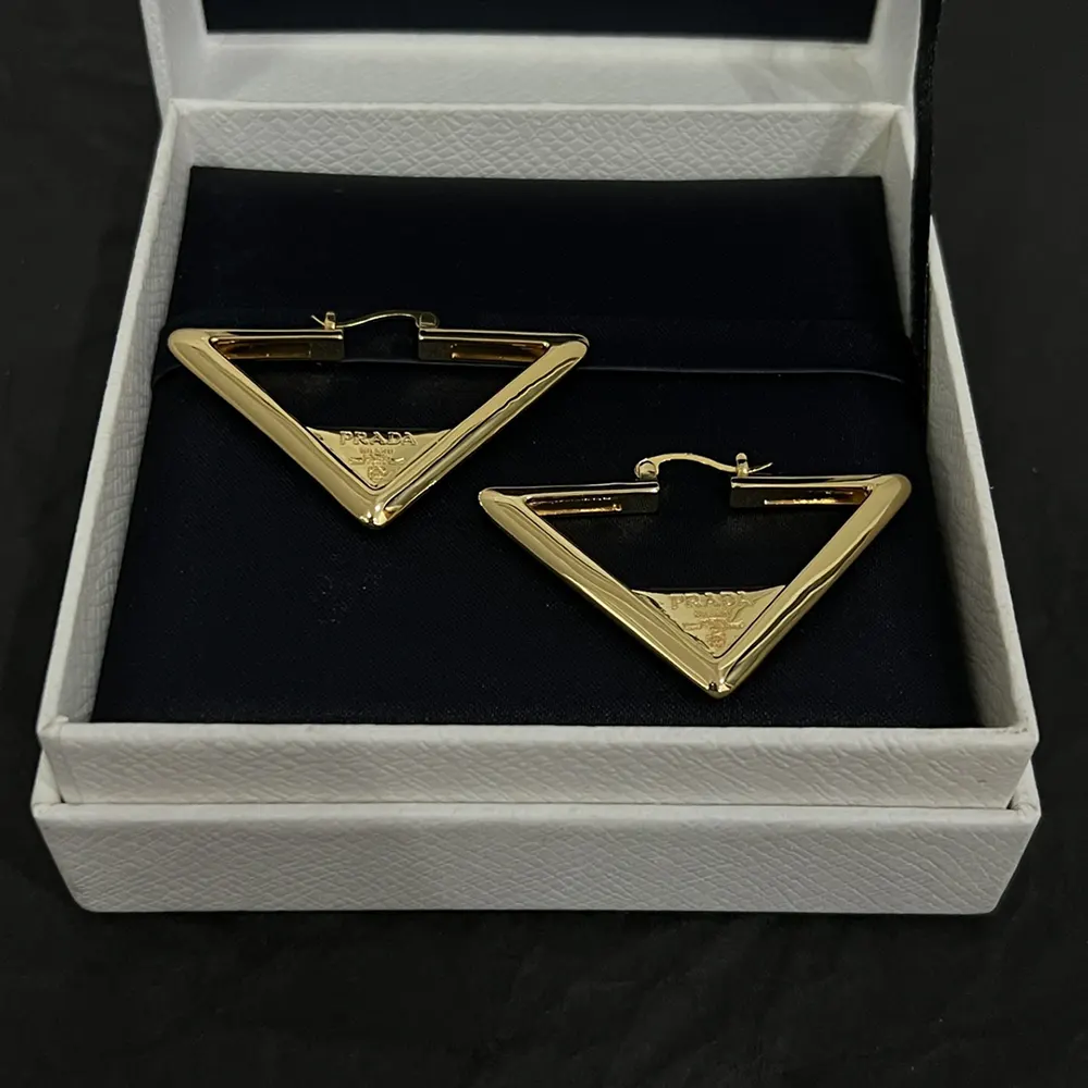 Side angle showing Prada Women Metal Earrings push-back closure
