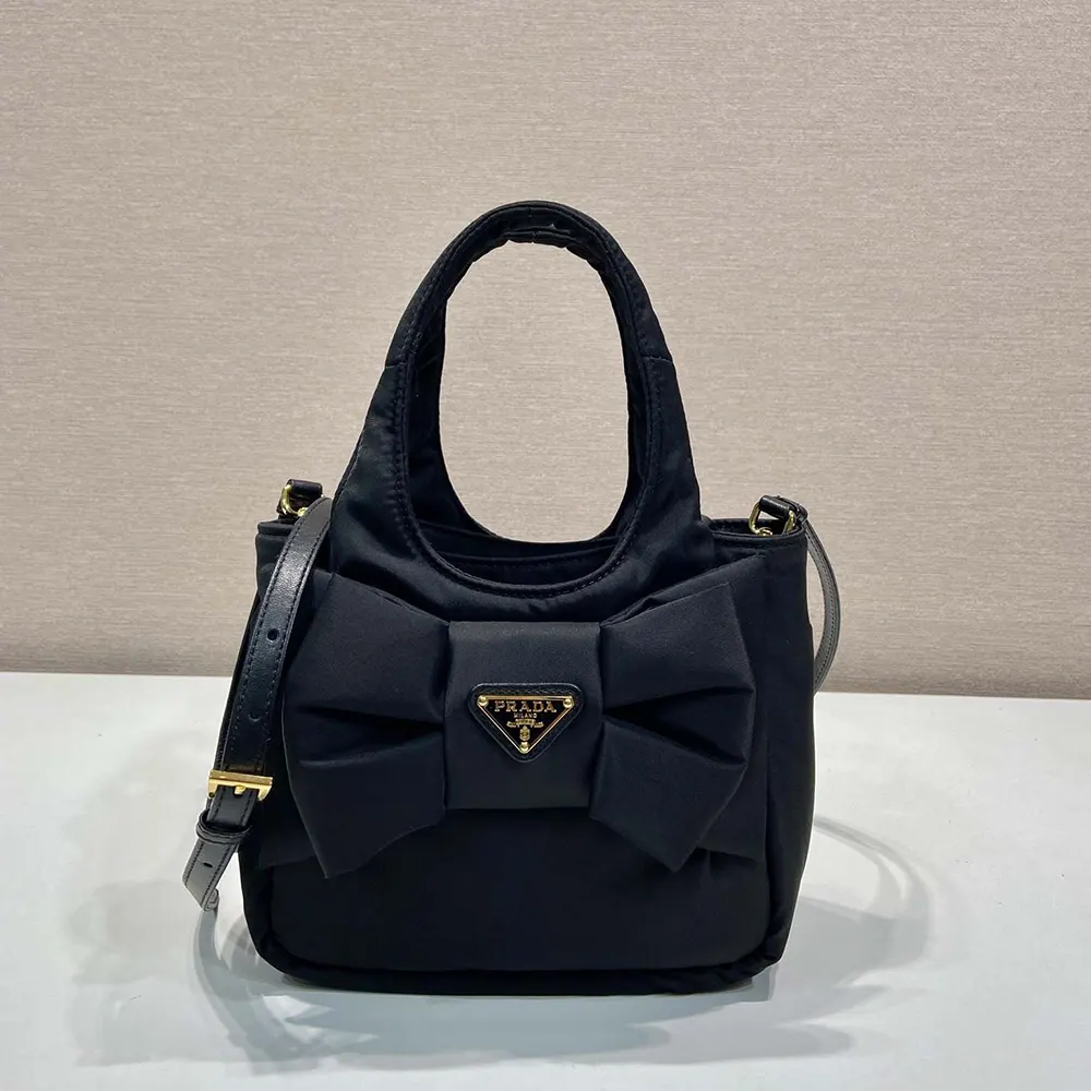 Close-up of Prada Women Padded Re-Nylon Mini-bag with Bow hardware and bow detail