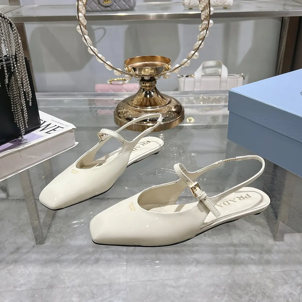 Top view showing glossy finish of Prada Women Patent Leather Slingback Ballerinas-White