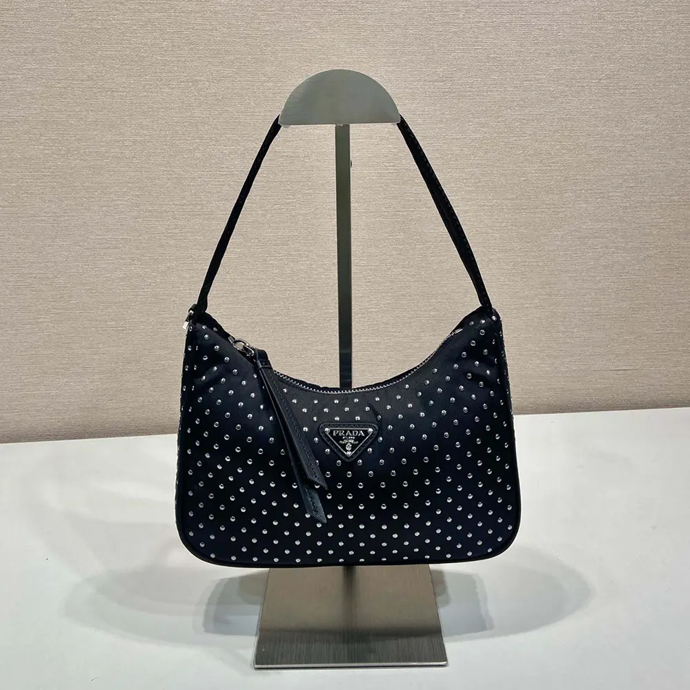 Side angle showing zip closure and strap of Prada Women Re-Edition Re-Nylon Mini Bag