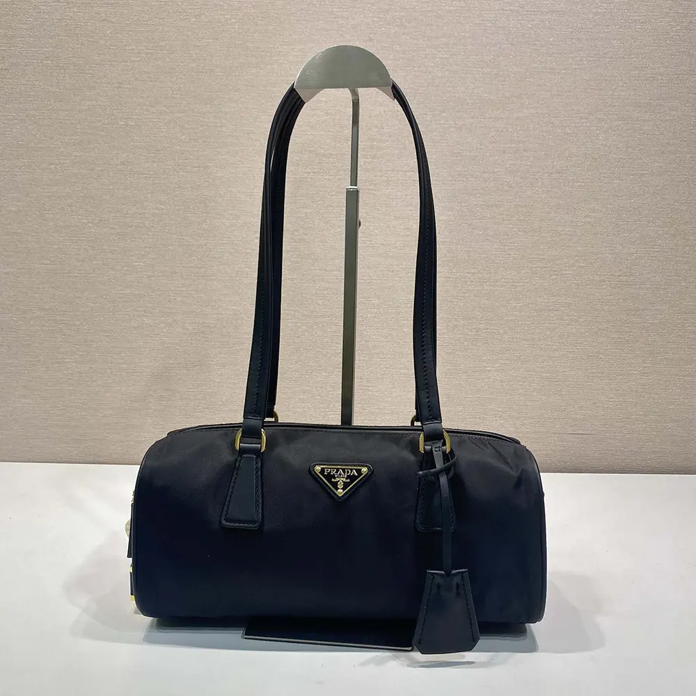 Close-up of padlock hardware on Prada Women Re-Nylon and Leather Medium Top-handle Bag