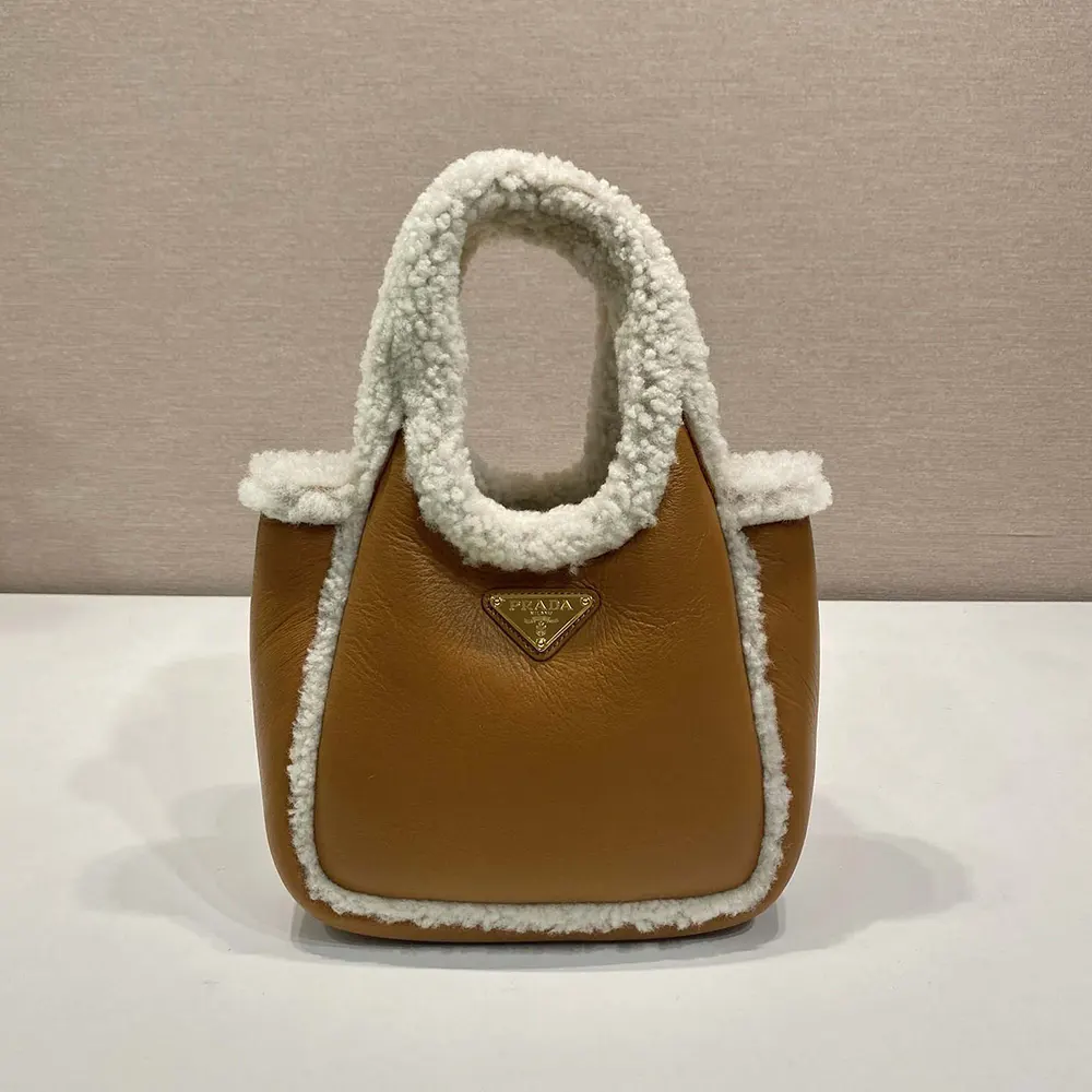 Side angle showing silhouette and adjustable strap of Prada Women Shearling Mini Handbag
