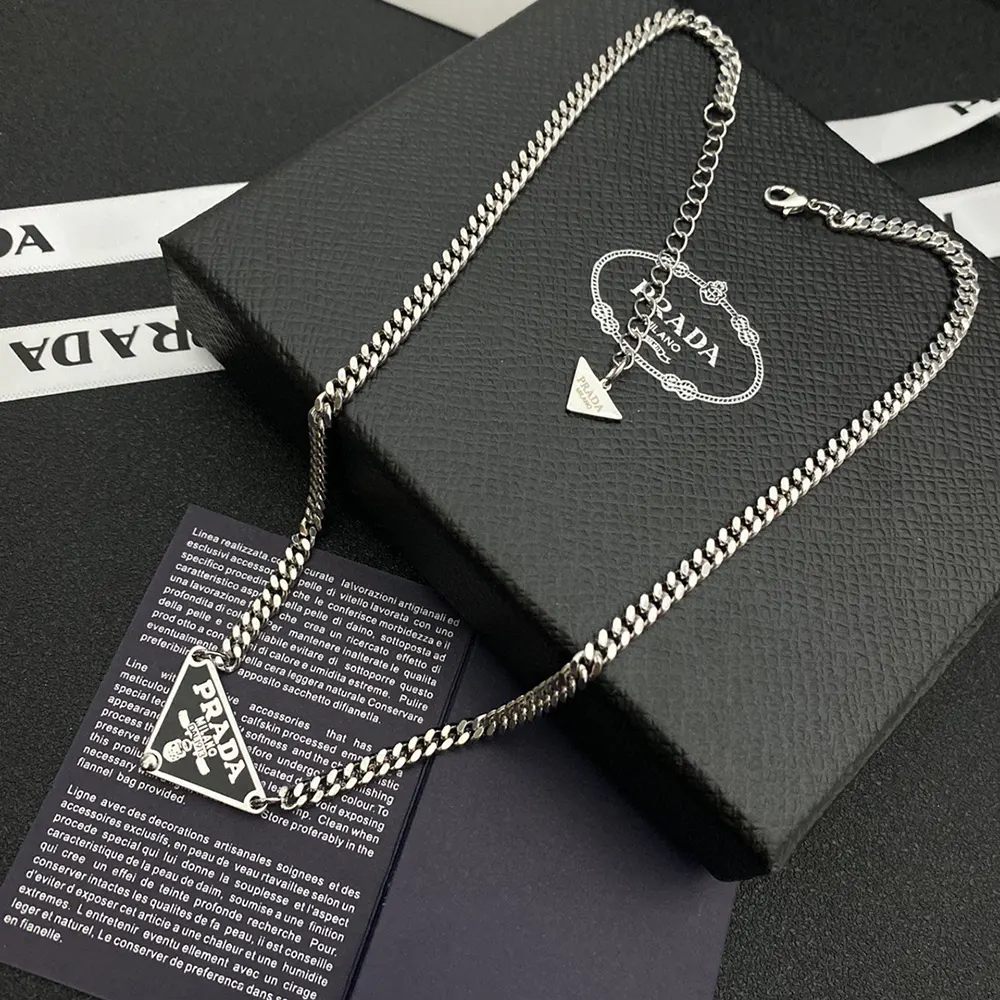 Model wearing Prada Women Symbole Necklace with layered jewelry look