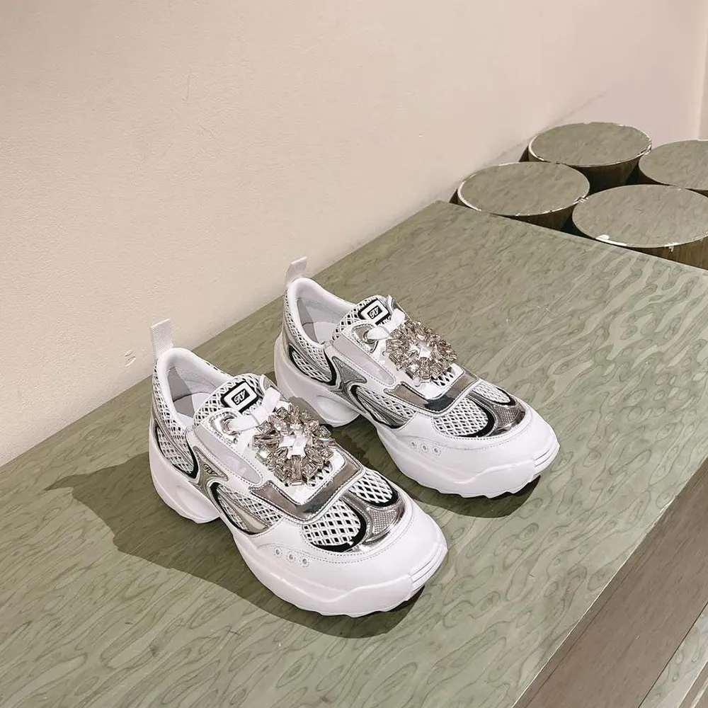Close-up of iconic buckle on Roger Vivier Women Viv’ on the Run Sneakers white