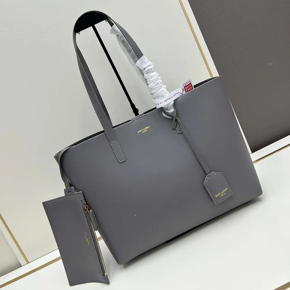Close-up of YSL silver hardware on gray leather bag