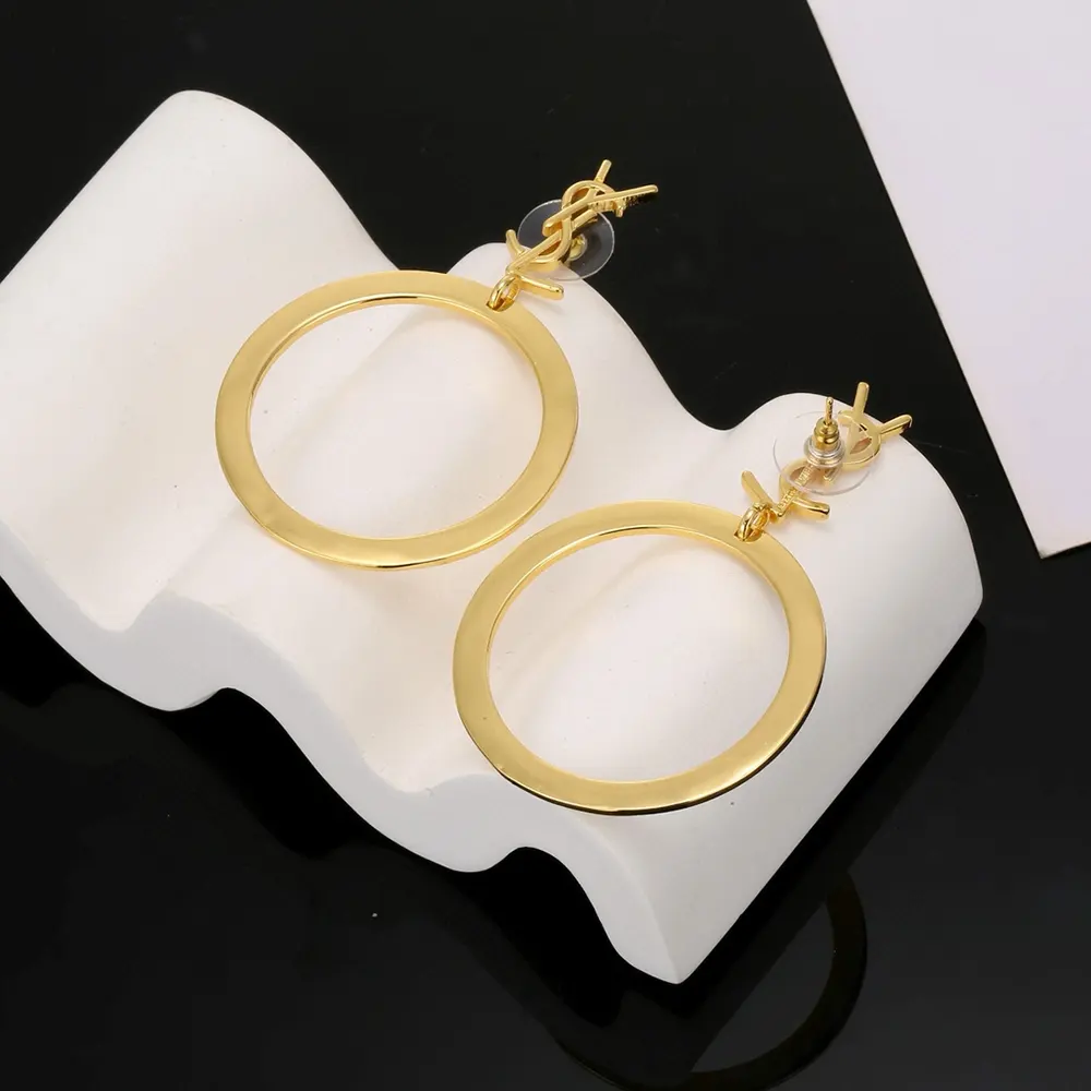 Side angle showing hinged closure on Saint Laurent YSL Cassandre pendant hoops