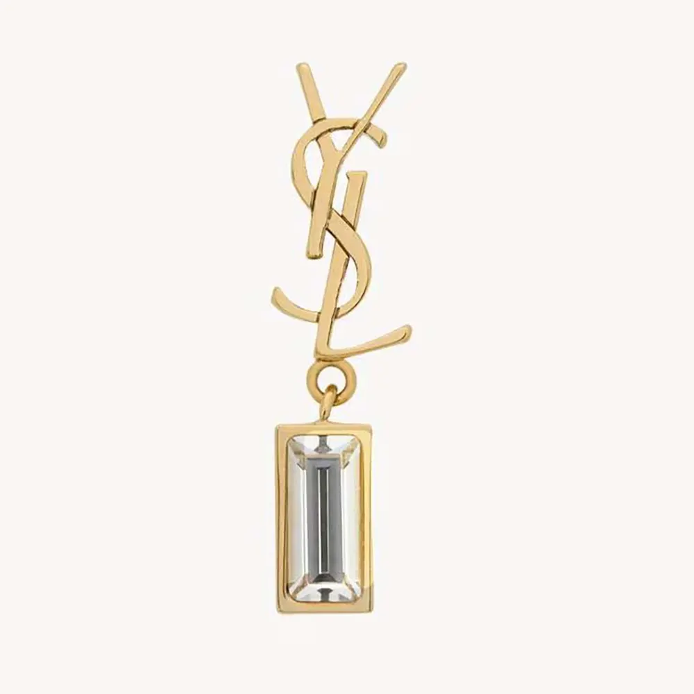 Close-up of Saint Laurent YSL Women Cassandre Single Earring gold metal and rhinestones