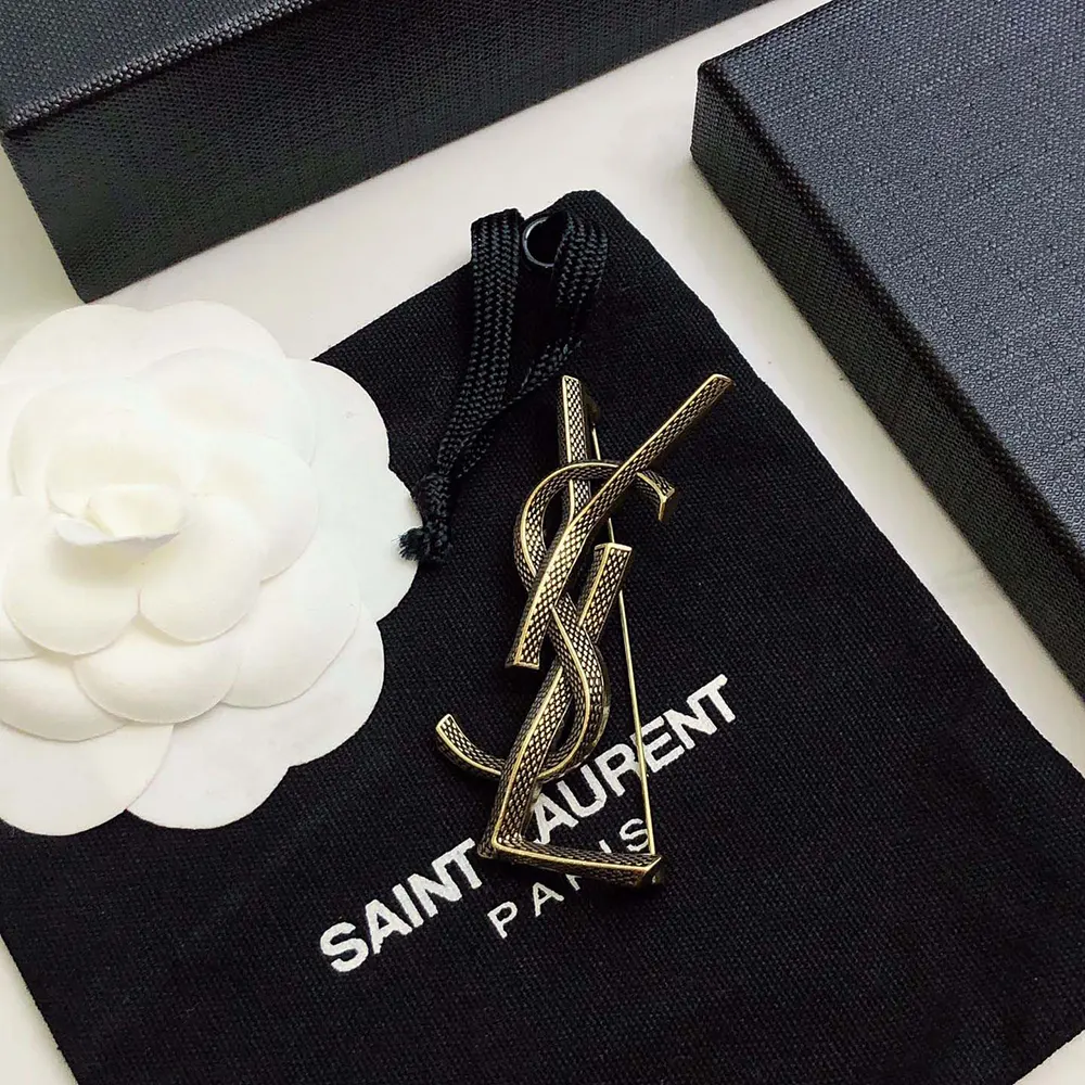 Side angle of Saint Laurent YSL Women Cassandre Snake Brooch showing pin closure