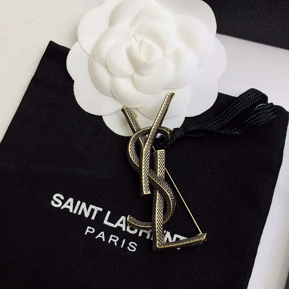 Front view of gold snake silhouette on Saint Laurent YSL Women Cassandre Brooch