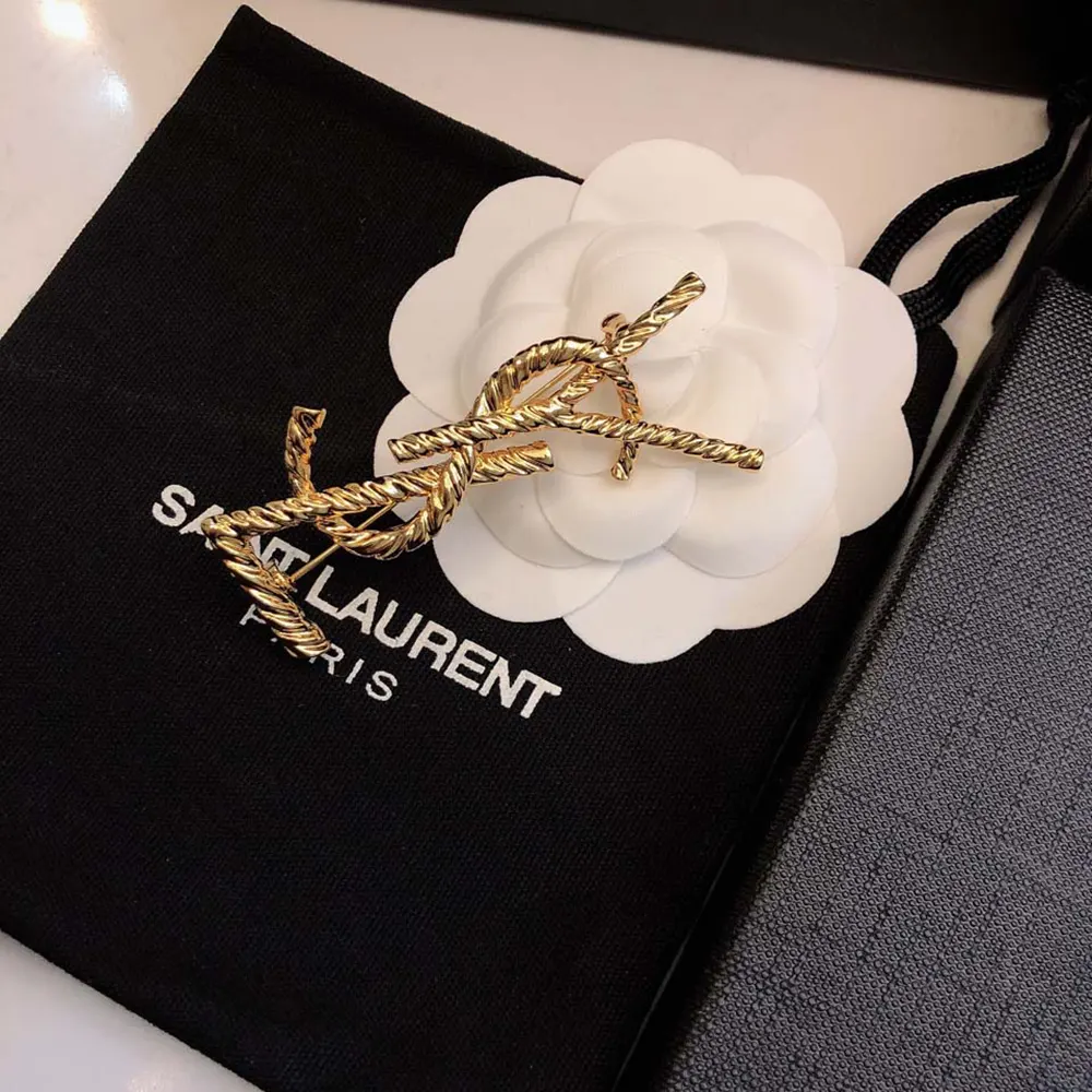 Saint Laurent YSL Women Cassandre YSL Brooch attached to blazer lapel