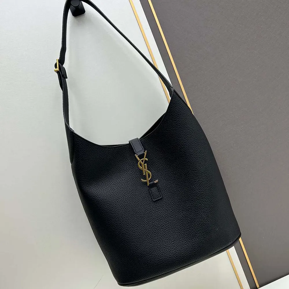 Close-up of gold YSL hardware on black leather Le 5 à 7 Hobo bag