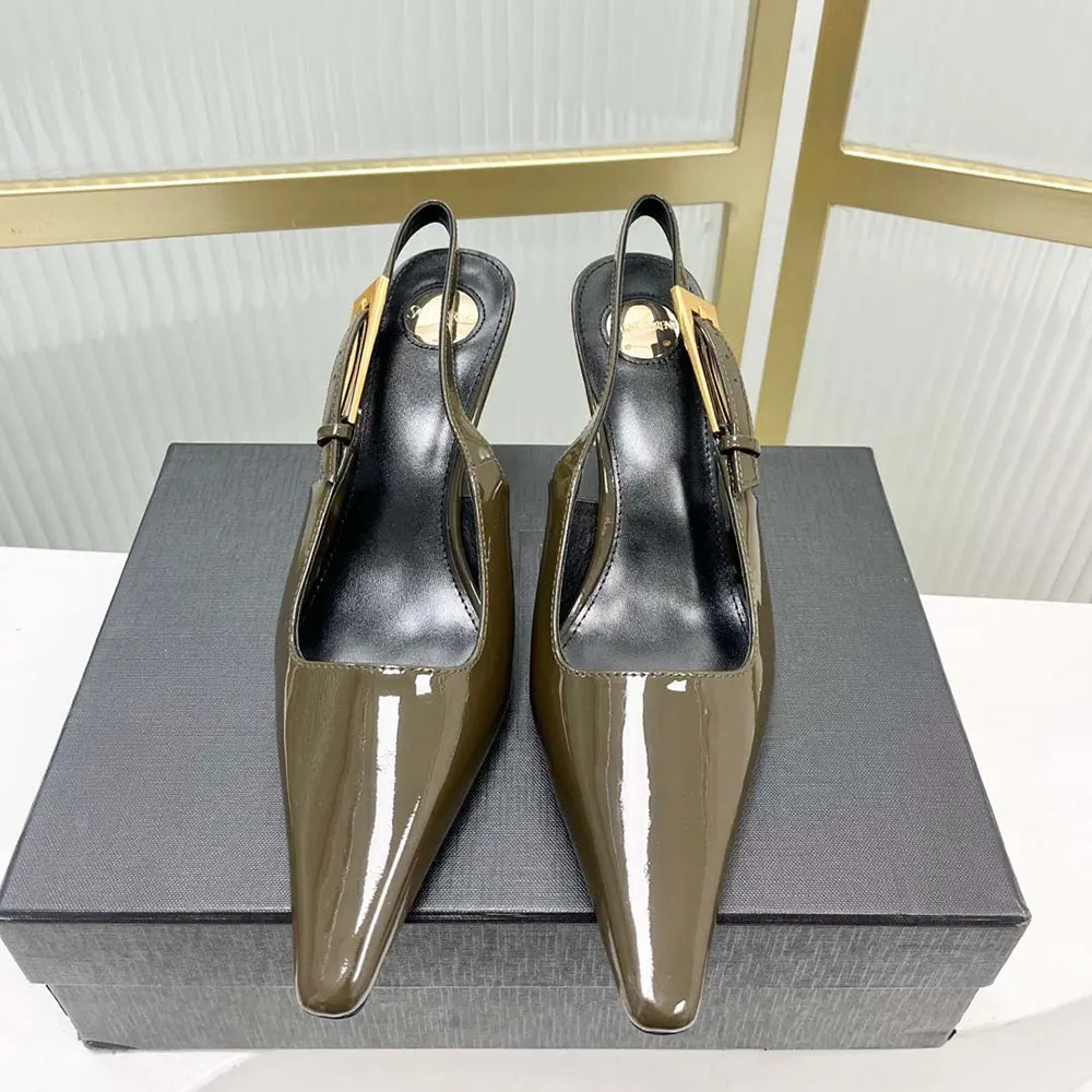 Close-up detail of gold YSL logo on dark green patent leather slingback pump