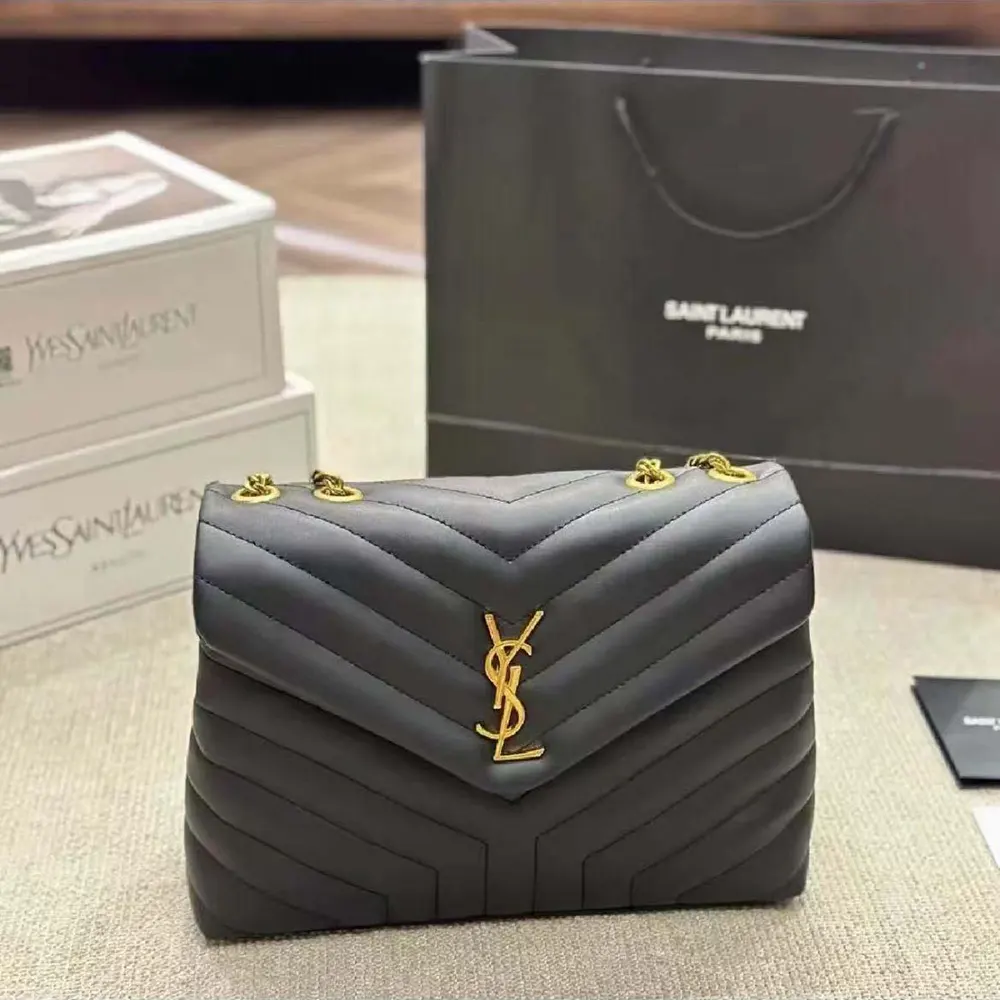 Close-up of gold YSL logo on Saint Laurent YSL Women Loulou Medium Bag