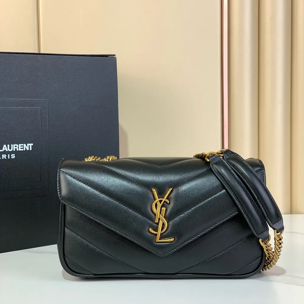 Close-up of gold YSL logo hardware on Loulou Small bag