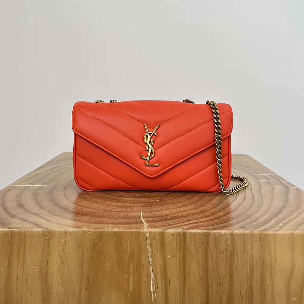 Side angle showing matelasse quilting on Saint Laurent Loulou Small bag