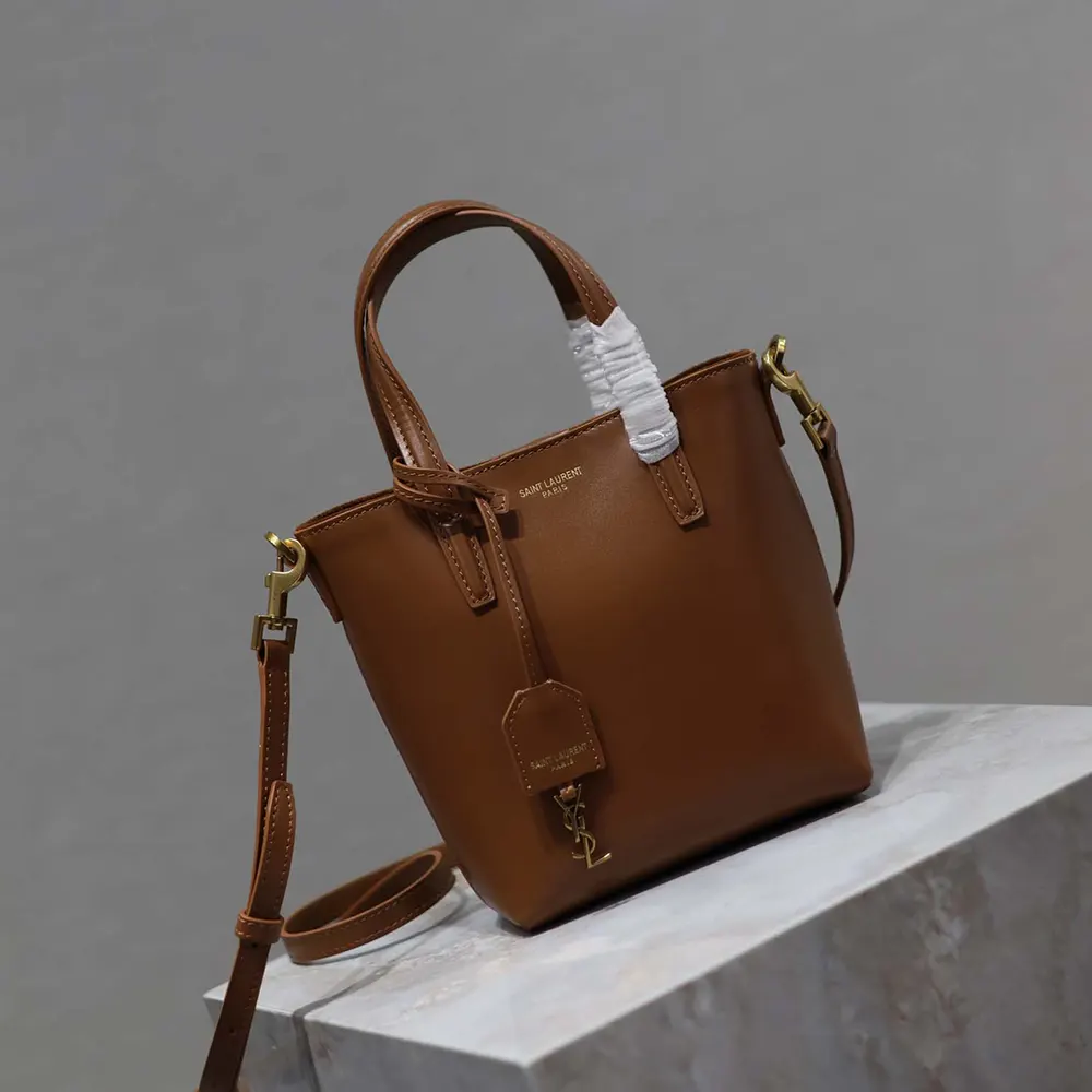 Side angle showing zipper closure and adjustable strap of the mini shoulder bag