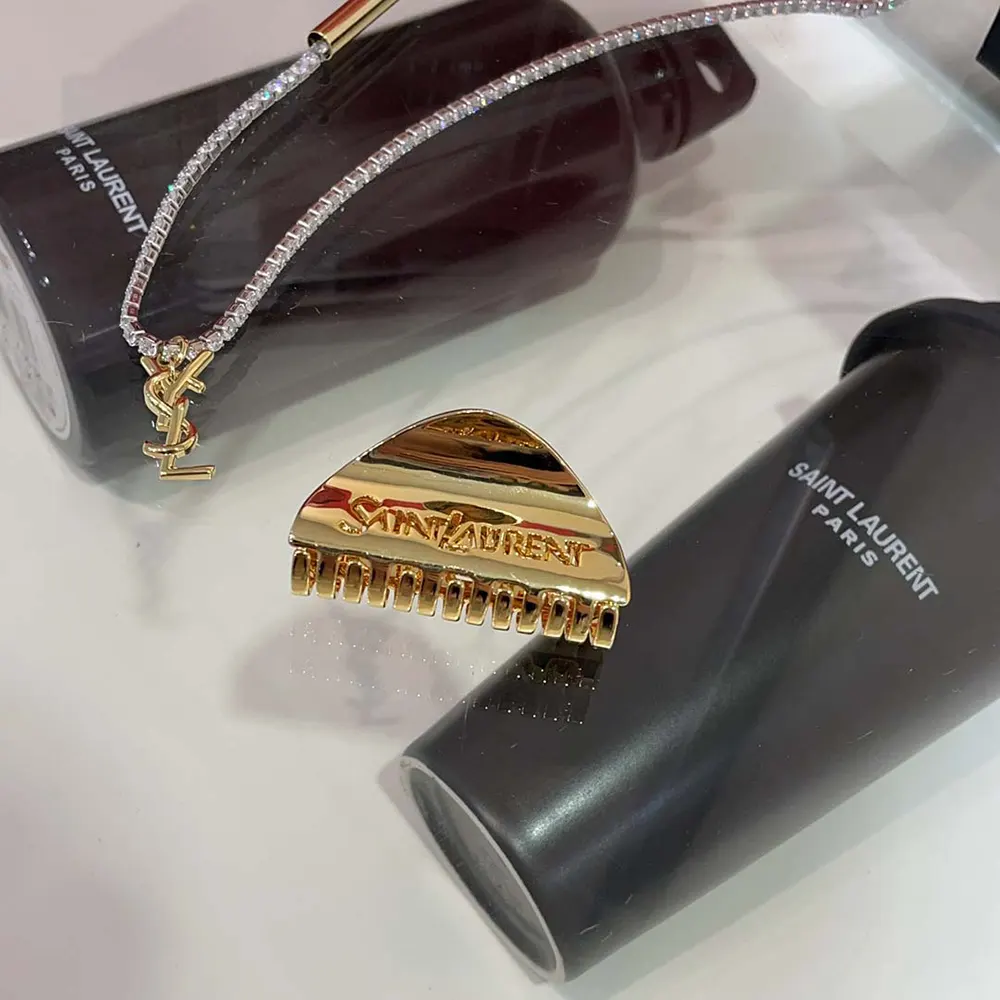 Saint Laurent YSL Women Saint Laurent Claw Clip holding hair in elegant style