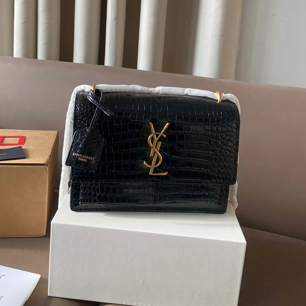 Side angle showing structured silhouette of Saint Laurent YSL Sunset bag