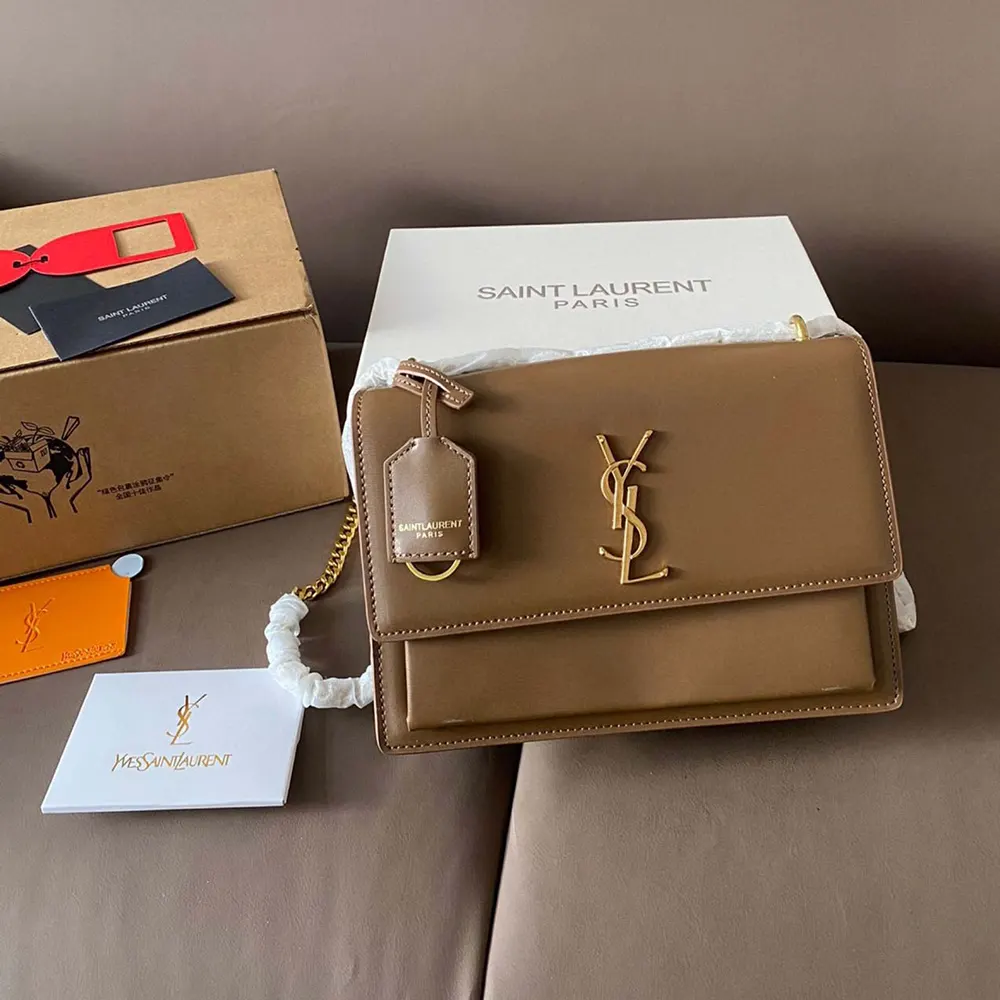 Close-up of gold YSL monogram hardware on Saint Laurent YSL Women Sunset Medium
