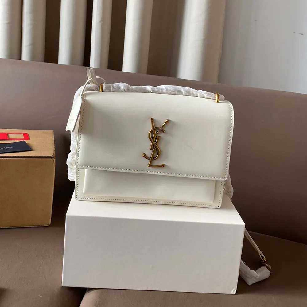Side profile showing smooth leather texture on Saint Laurent YSL bag