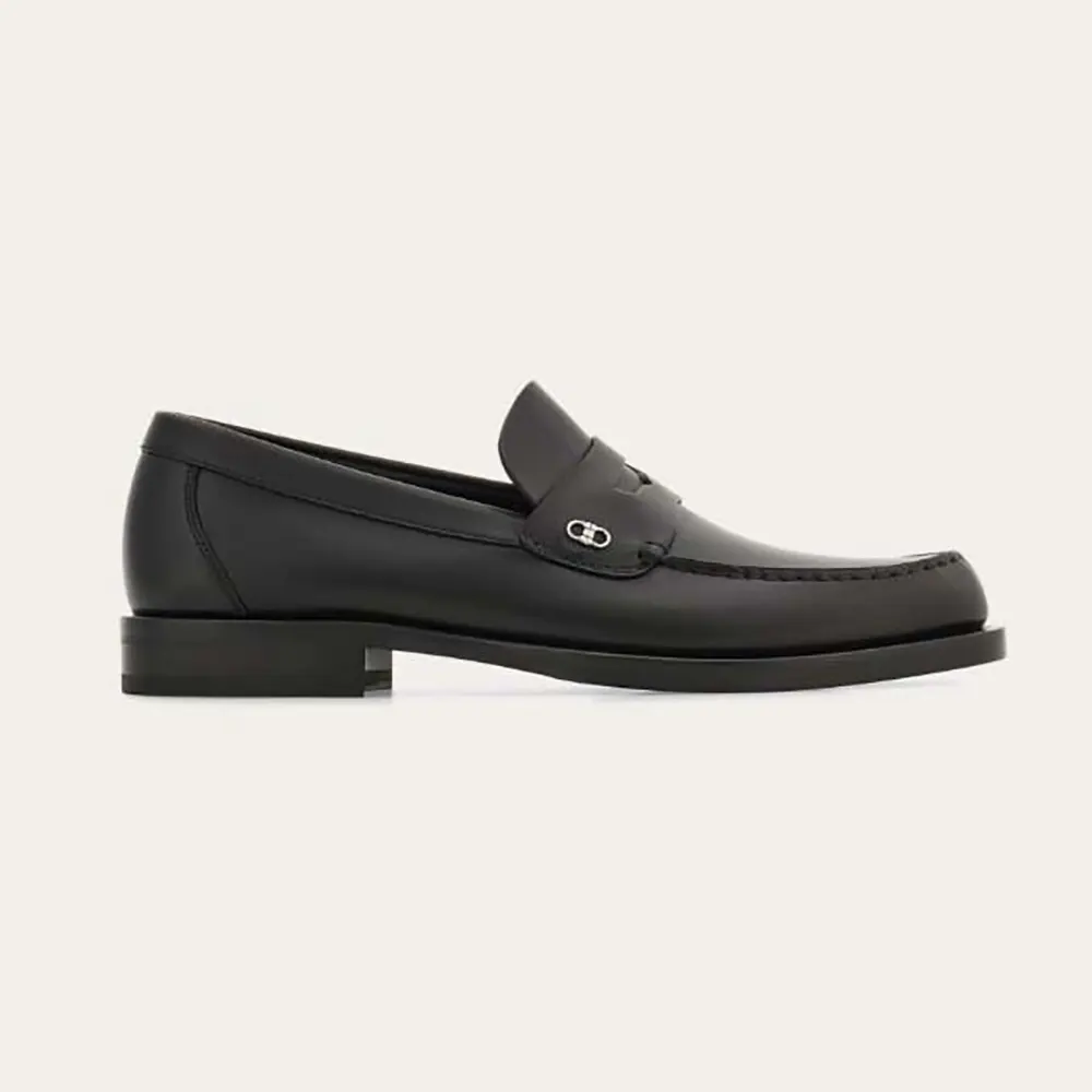 Side view of Salvatore Ferragamo Men Penny loafer with Gancini Ornament in black leather