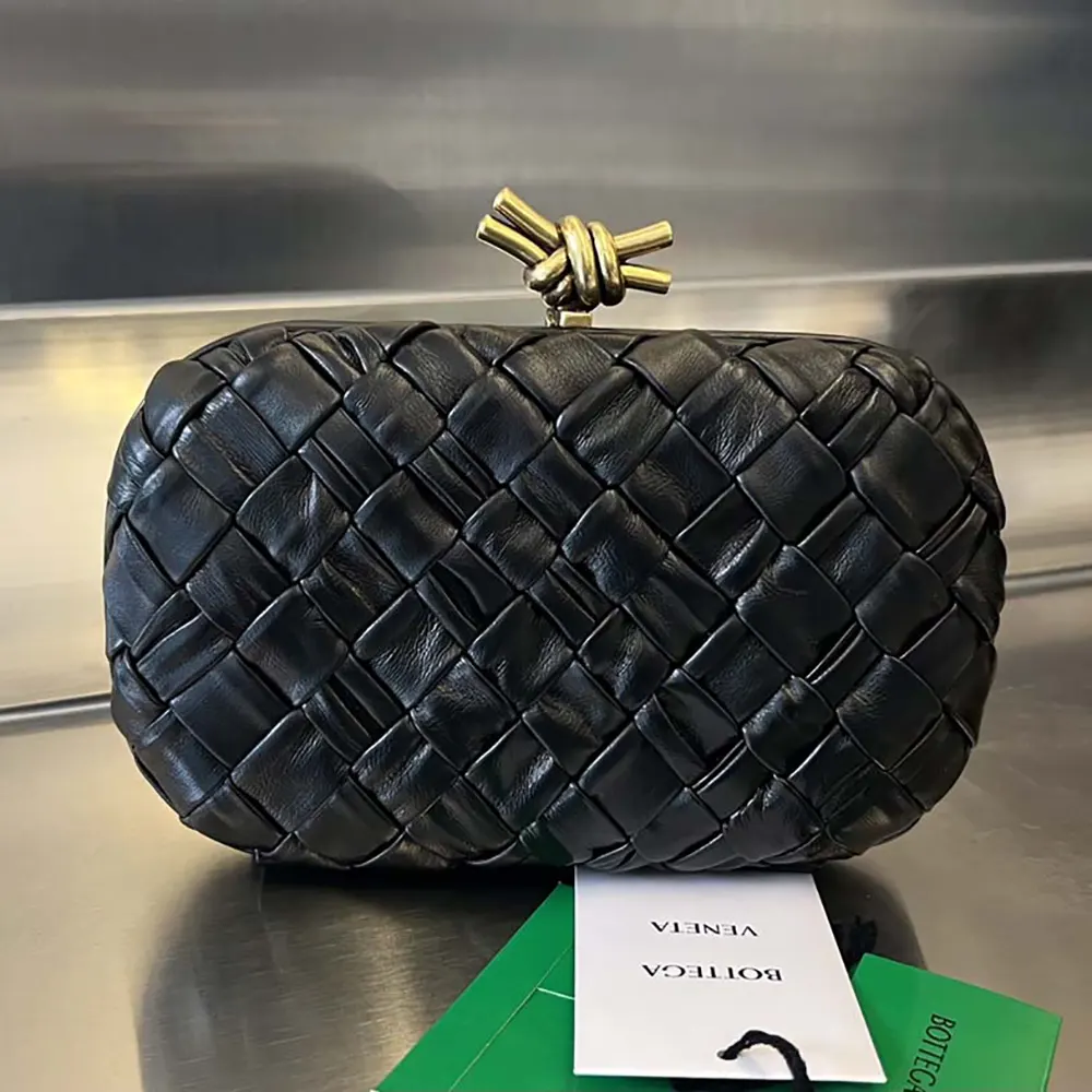 Close-up of knotted metal closure on Bottega Veneta Women Knot Minaudière Clutch