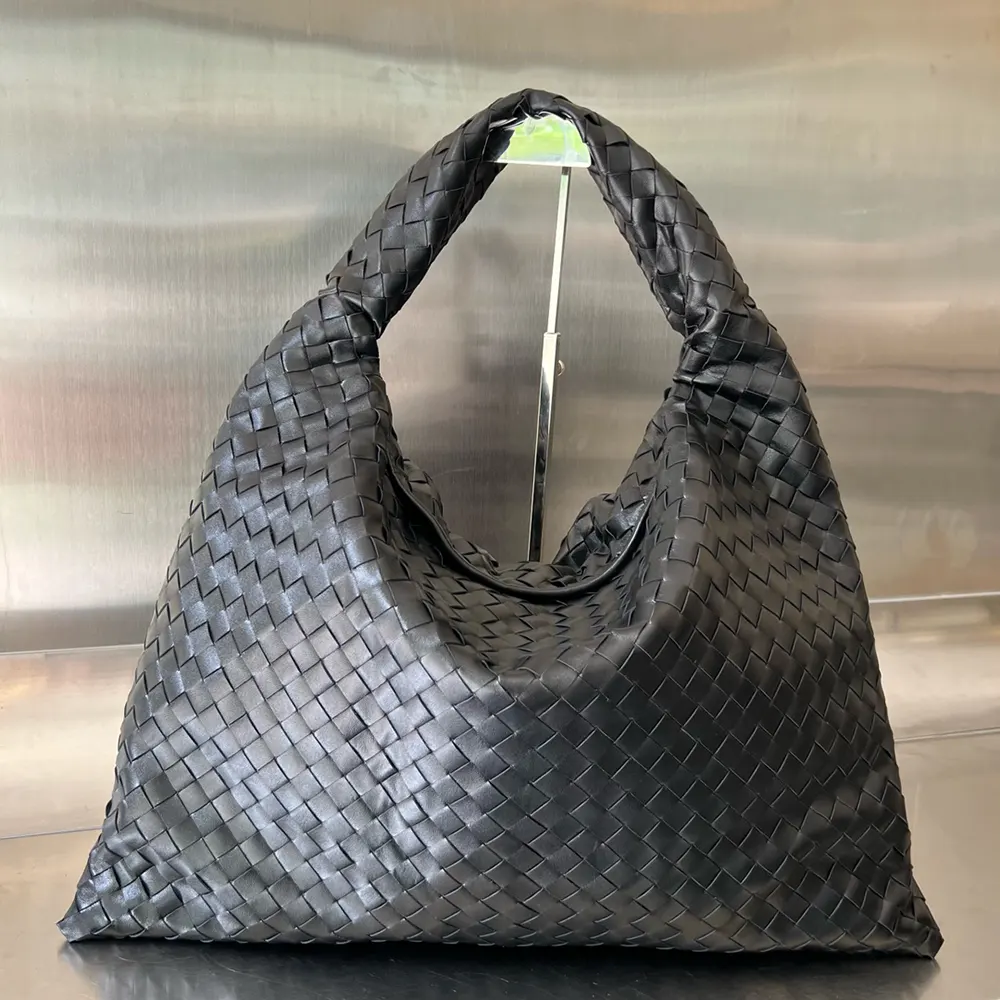 Close-up of gold-toned intrecciato hardware on Bottega Veneta Large Hop Shoulder Bag