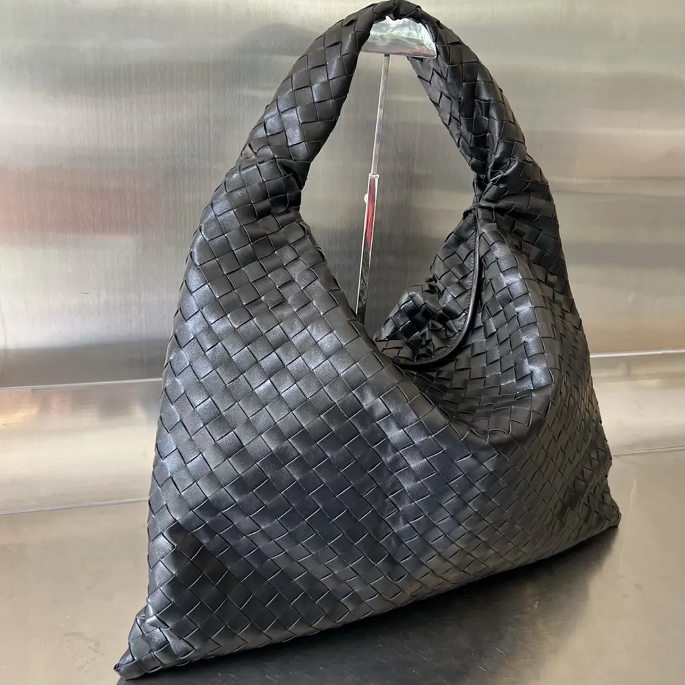 Side profile highlighting the smooth calf leather texture on Bottega Veneta shoulder bag