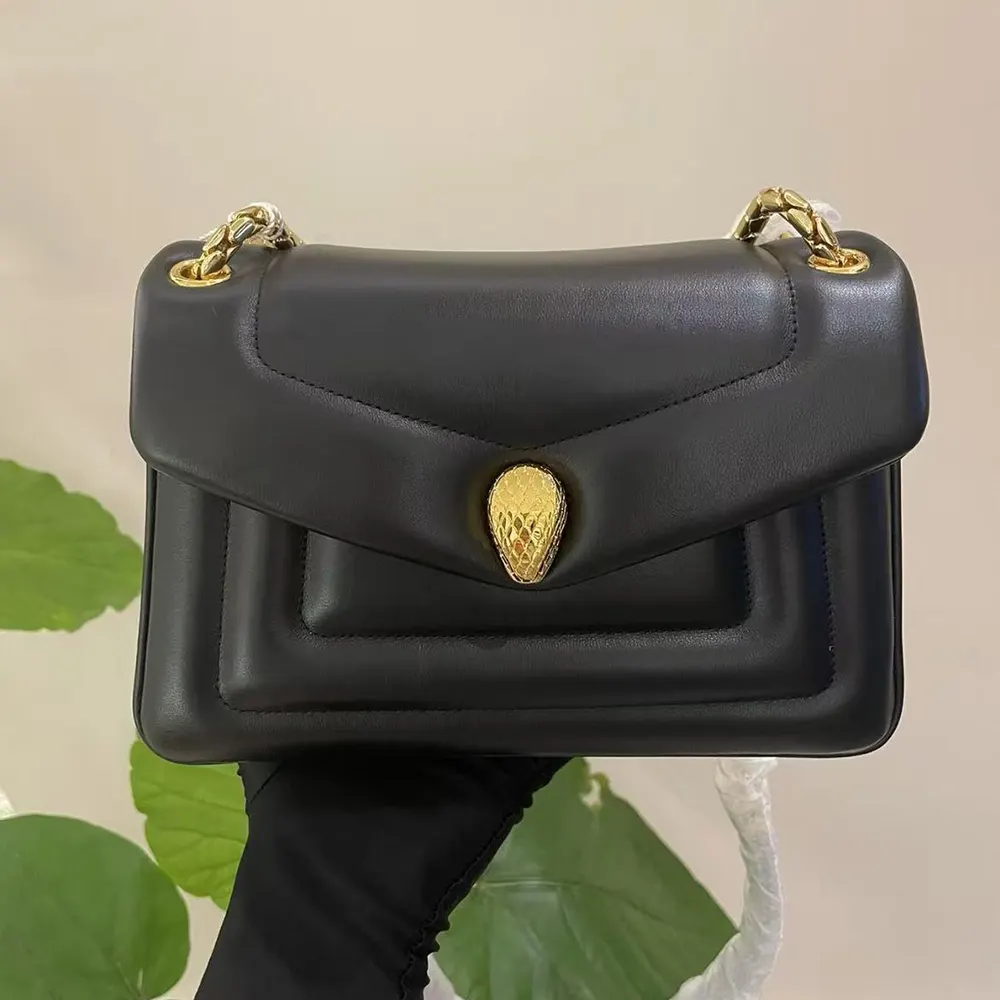 Side profile of Bvlgari Women Serpenti Reverse Shoulder Bag-Black with adjustable strap