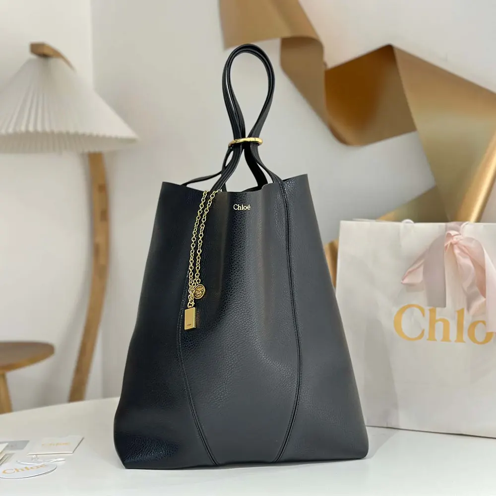 Side angle showing silhouette and texture of Chloe Women Large Chloé Spin Tote Bag