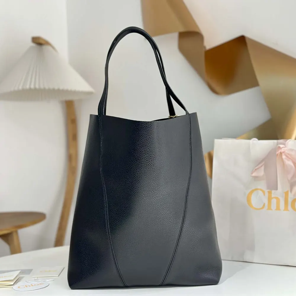 Close-up of signature Spin hardware on Chloe Women Large Chloé Spin Tote Bag