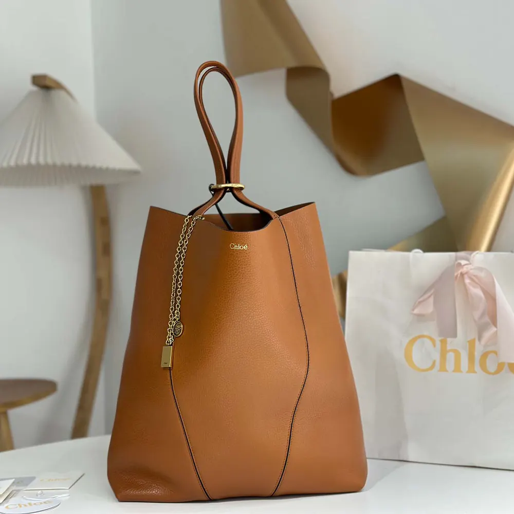 Side profile showing spacious interior of Chloe Women Large Chloé Spin Tote Bag