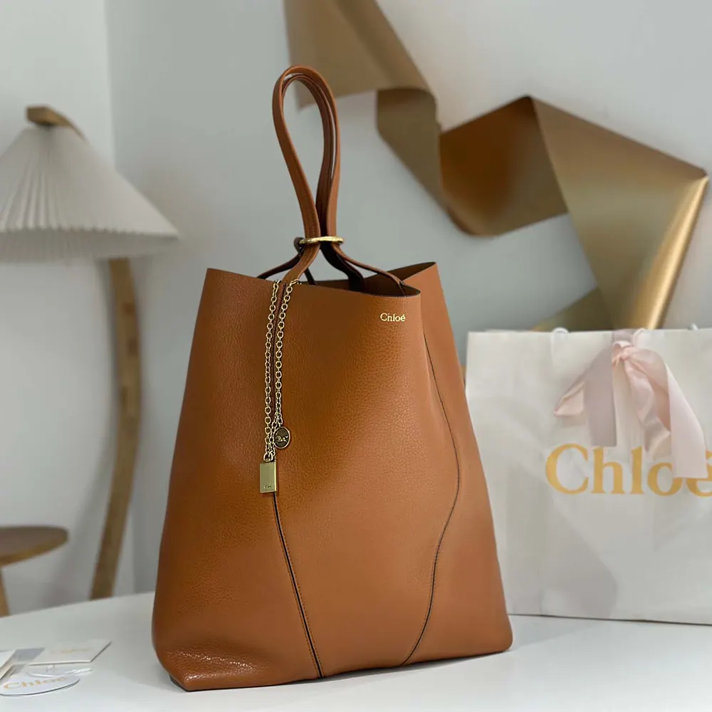 Close-up of spin-lock closure on Chloe Women Large Chloé Spin Tote Bag
