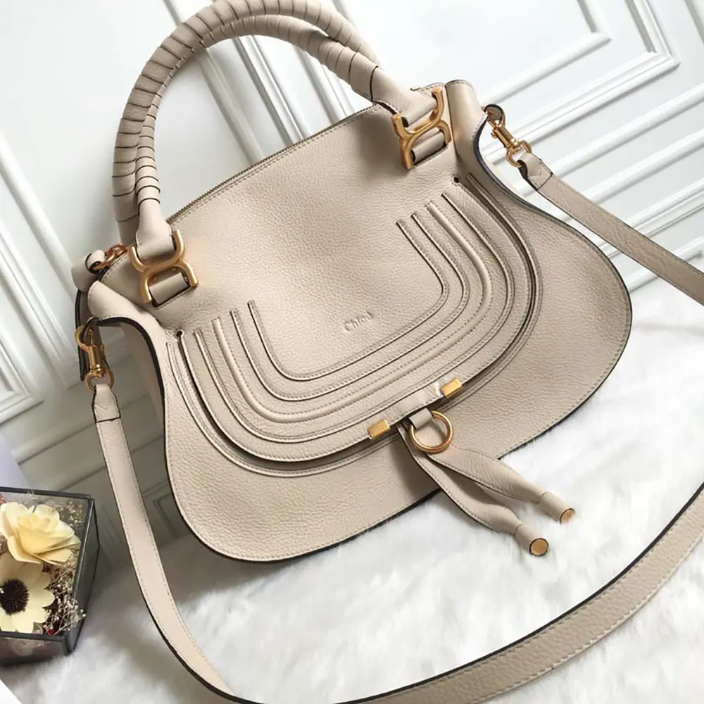 Close-up of whipstitch detailing on Chloe Women Marcie Bag flap