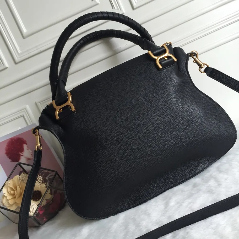 Side angle showing silhouette of Chloe Women Marcie Bag in black leather