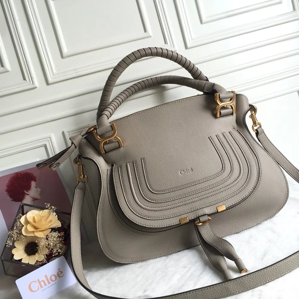 Close-up on braided leather handle of Chloe Women Marcie Bag in Grey