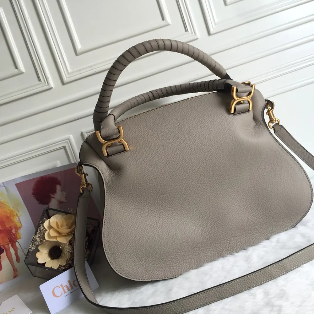 Side profile showing gold clasp on Chloe Women Marcie Bag in Grey
