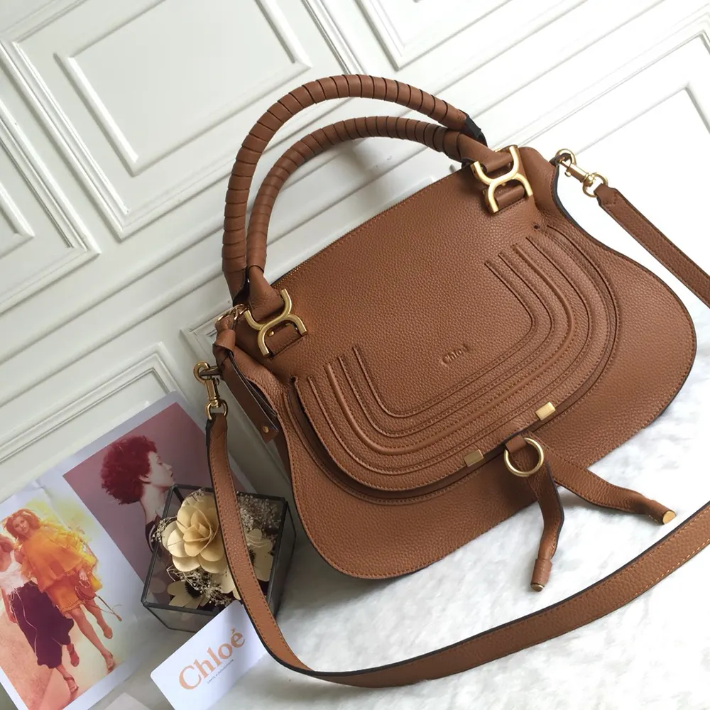 Close-up of gold-tone ring and stud hardware on Chloe Women Marcie Bag