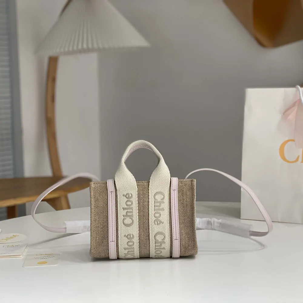 Close-up of gold hardware and pink leather on Chloe Women Mini Woody Tote Bag
