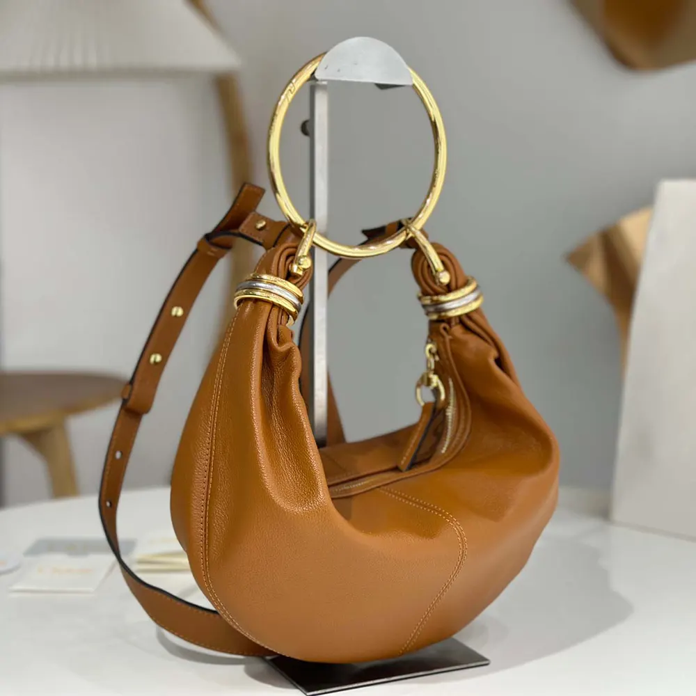 Side profile showing compact silhouette of Chloe Women Small Bracelet Hobo Bag