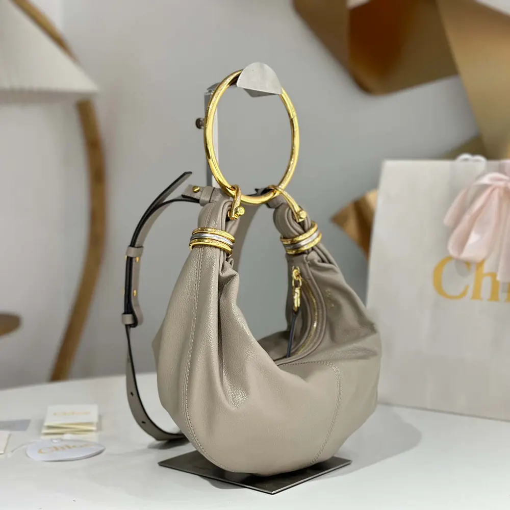 Side profile showing silhouette of Chloe Women Small Bracelet Hobo Bag Grey